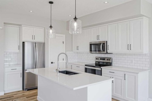 28 Willow Street, Cochrane, AB - Indoor Photo Showing Kitchen With Double Sink With Upgraded Kitchen