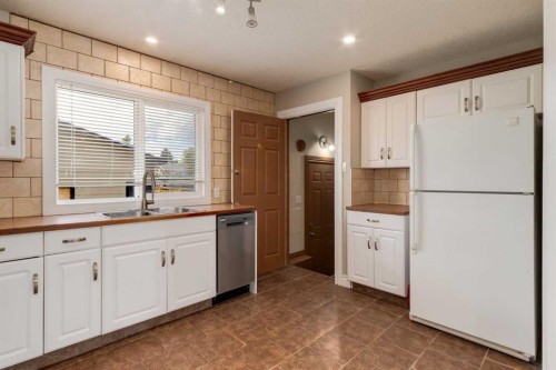 1321 39 Street Se, Calgary, AB - Indoor Photo Showing Kitchen With Double Sink