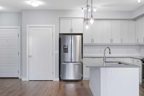 308-100 Auburn Meadows Manor Se, Calgary, AB - Indoor Photo Showing Kitchen With Stainless Steel Kitchen With Double Sink
