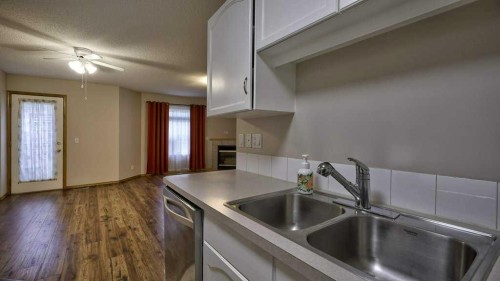 32 Mt Aberdeen Manor Se, Calgary, AB - Indoor Photo Showing Kitchen With Double Sink
