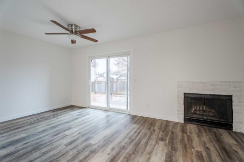 D-11111 Oakfield Drive Sw, Calgary, AB - Indoor Photo Showing Living Room With Fireplace