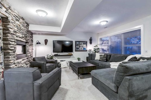 31 Tusslewood View Nw, Calgary, AB - Indoor Photo Showing Living Room With Fireplace