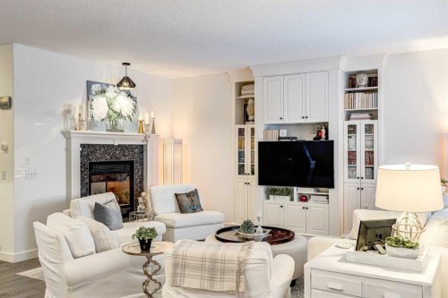 31 Tusslewood View Nw, Calgary, AB - Indoor Photo Showing Living Room With Fireplace