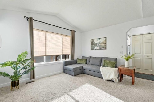 303 Drake Landing Close, Okotoks, AB - Indoor Photo Showing Living Room