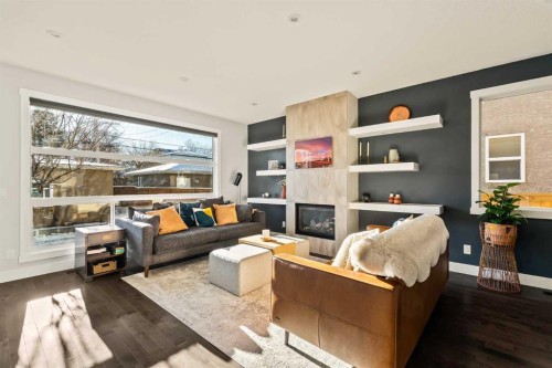 447B 23 Avenue Nw, Calgary, AB - Indoor Photo Showing Living Room With Fireplace