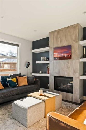 447B 23 Avenue Nw, Calgary, AB - Indoor Photo Showing Living Room With Fireplace