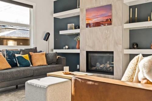 447B 23 Avenue Nw, Calgary, AB - Indoor Photo Showing Living Room With Fireplace