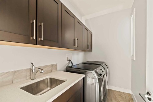 447B 23 Avenue Nw, Calgary, AB - Indoor Photo Showing Laundry Room