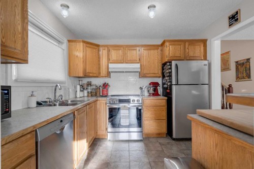 3 Booth Crescent, Irricana, AB - Indoor Photo Showing Kitchen With Double Sink