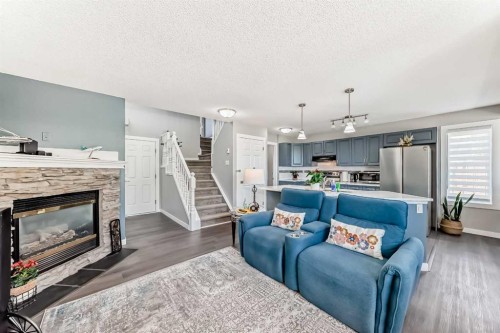 137 Coverton Circle Ne, Calgary, AB - Indoor Photo Showing Living Room With Fireplace