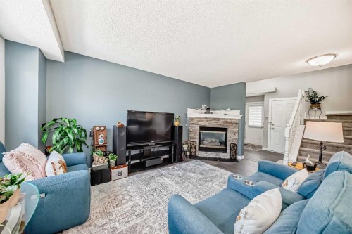 137 Coverton Circle Ne, Calgary, AB - Indoor Photo Showing Living Room With Fireplace
