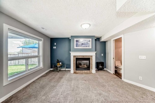 137 Coverton Circle Ne, Calgary, AB - Indoor With Fireplace