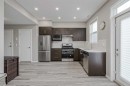 203-130 Redstone Walk Ne, Calgary, AB  - Indoor Photo Showing Kitchen With Stainless Steel Kitchen 