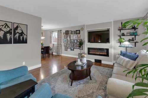 724 Mapleton Drive Se, Calgary, AB - Indoor Photo Showing Living Room With Fireplace