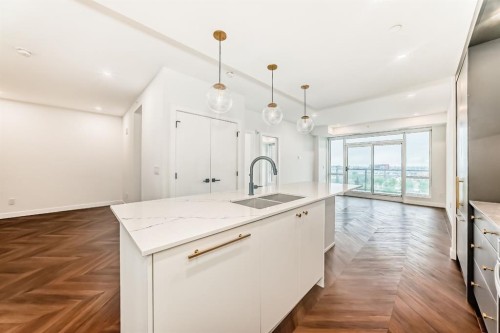 410-8505 Broadcast Avenue Sw, Calgary, AB - Indoor Photo Showing Kitchen With Double Sink With Upgraded Kitchen