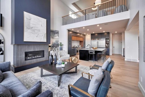 218 Aspen Summit Place Sw, Calgary, AB - Indoor Photo Showing Living Room With Fireplace