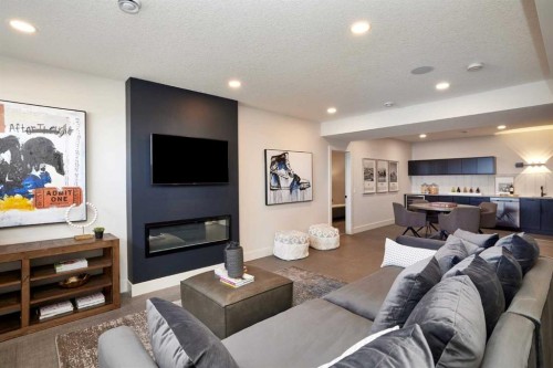 218 Aspen Summit Place Sw, Calgary, AB - Indoor Photo Showing Living Room With Fireplace