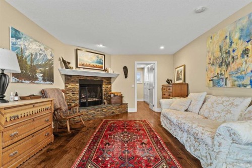 656 Royalite Way Se, Diamond Valley, AB - Indoor Photo Showing Living Room With Fireplace