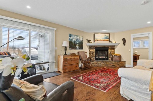 656 Royalite Way Se, Diamond Valley, AB - Indoor Photo Showing Living Room With Fireplace