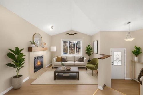 231 Saddlebrook Way Ne, Calgary, AB - Indoor Photo Showing Living Room With Fireplace