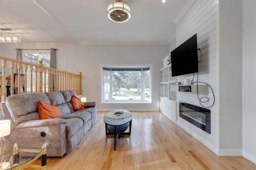 55 Bermuda Place Nw, Calgary, AB - Indoor Photo Showing Living Room With Fireplace