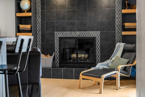 92 Deermeade Road Se, Calgary, AB - Indoor Photo Showing Other Room With Fireplace