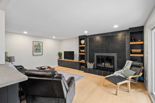 92 Deermeade Road Se, Calgary, AB - Indoor Photo Showing Living Room With Fireplace