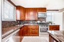 3042 31A Street Se, Calgary, AB  - Indoor Photo Showing Kitchen With Double Sink 