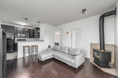 311-1540 17 Avenue Sw, Calgary, AB - Indoor Photo Showing Living Room With Fireplace