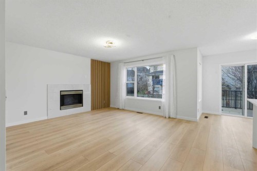 210 Douglas Glen Point Se, Calgary, AB - Indoor Photo Showing Living Room With Fireplace