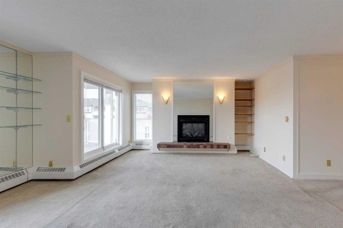 206-3737 42 Street Nw, Calgary, AB - Indoor Photo Showing Living Room With Fireplace