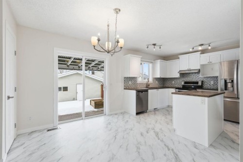 82 Bridleridge Way Sw, Calgary, AB - Indoor Photo Showing Kitchen With Stainless Steel Kitchen With Upgraded Kitchen