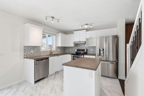 82 Bridleridge Way Sw, Calgary, AB - Indoor Photo Showing Kitchen With Stainless Steel Kitchen With Upgraded Kitchen