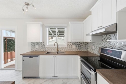 82 Bridleridge Way Sw, Calgary, AB - Indoor Photo Showing Kitchen