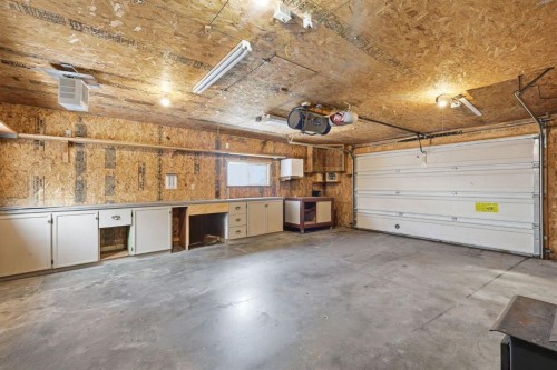 82 Bridleridge Way Sw, Calgary, AB - Indoor Photo Showing Garage