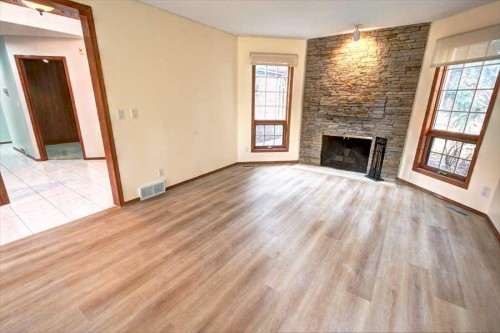 6967 Christie Estate Boulevard Sw, Calgary, AB - Indoor Photo Showing Living Room With Fireplace
