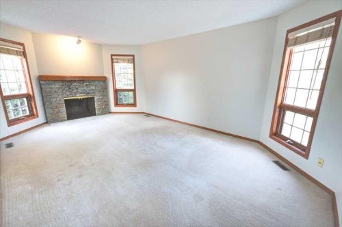 6967 Christie Estate Boulevard Sw, Calgary, AB - Indoor Photo Showing Living Room With Fireplace