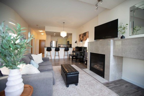 1707-1108 6 Avenue Sw, Calgary, AB - Indoor Photo Showing Living Room With Fireplace