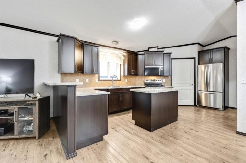 117 Range Rd 250, Mossleigh, AB - Indoor Photo Showing Kitchen With Upgraded Kitchen