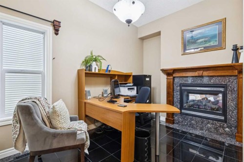 54 Discovery Ridge Gardens Sw, Calgary, AB - Indoor With Fireplace