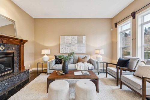 54 Discovery Ridge Gardens Sw, Calgary, AB - Indoor Photo Showing Living Room With Fireplace