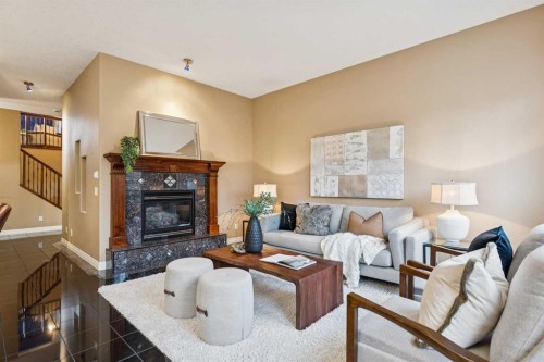 54 Discovery Ridge Gardens Sw, Calgary, AB - Indoor Photo Showing Living Room With Fireplace