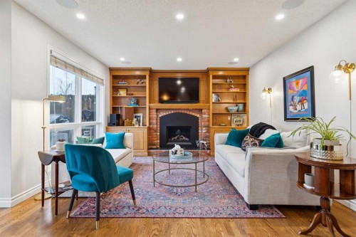 206 Signal Hill Point Sw, Calgary, AB - Indoor Photo Showing Living Room With Fireplace
