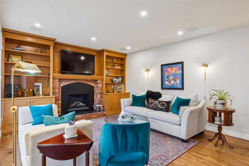 206 Signal Hill Point Sw, Calgary, AB - Indoor Photo Showing Living Room With Fireplace