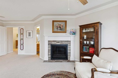 206 Signal Hill Point Sw, Calgary, AB - Indoor Photo Showing Living Room With Fireplace