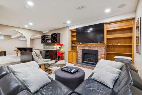 206 Signal Hill Point Sw, Calgary, AB - Indoor With Fireplace