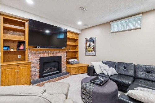 206 Signal Hill Point Sw, Calgary, AB - Indoor With Fireplace