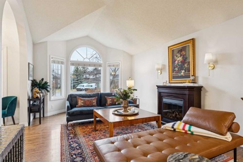 206 Signal Hill Point Sw, Calgary, AB - Indoor Photo Showing Living Room With Fireplace