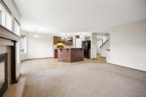 49 Sage Valley Manor Nw, Calgary, AB - Indoor Photo Showing Kitchen With Fireplace