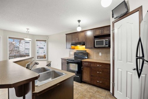 49 Sage Valley Manor Nw, Calgary, AB - Indoor Photo Showing Kitchen With Double Sink